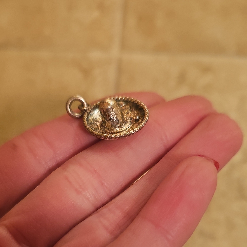 Sterling silver sombrero charm.
